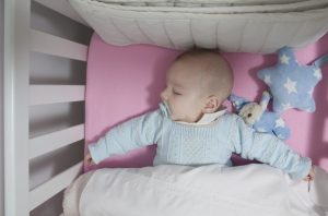Baby sleepng in a crib