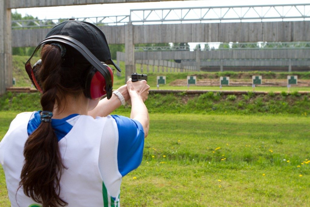 Woman practicing in the shooting range