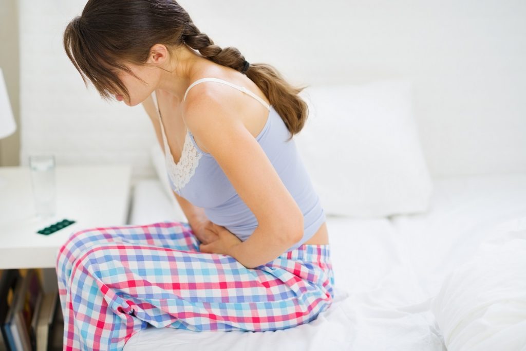 Woman having period cramps