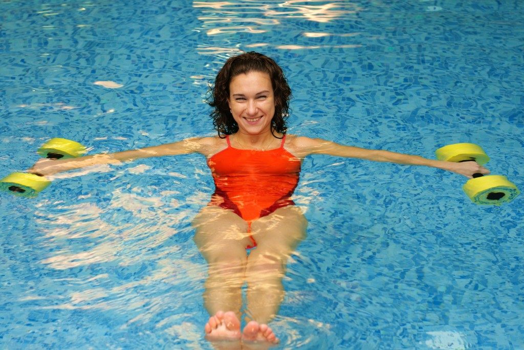 woman doing water exercise in a pool
