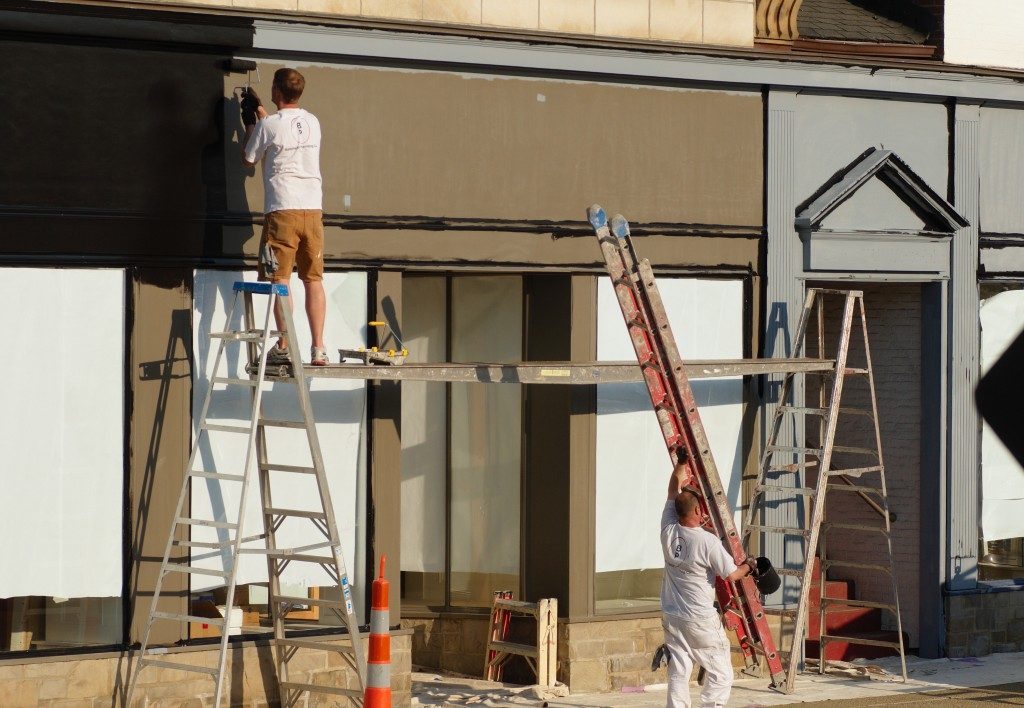 men working on restoring a building