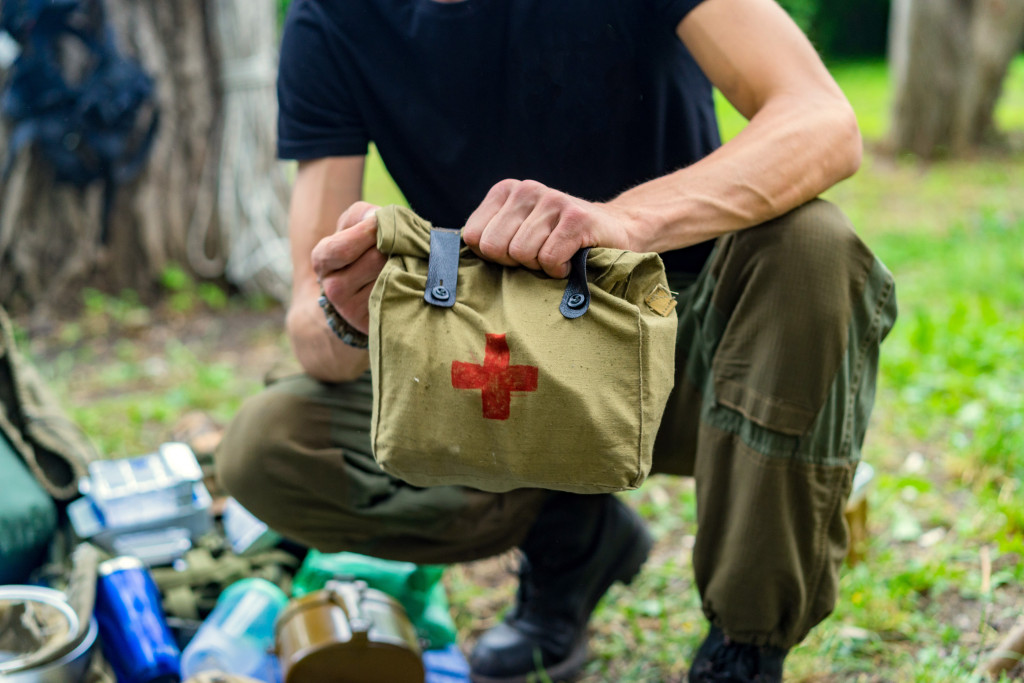 man holding emergency kit