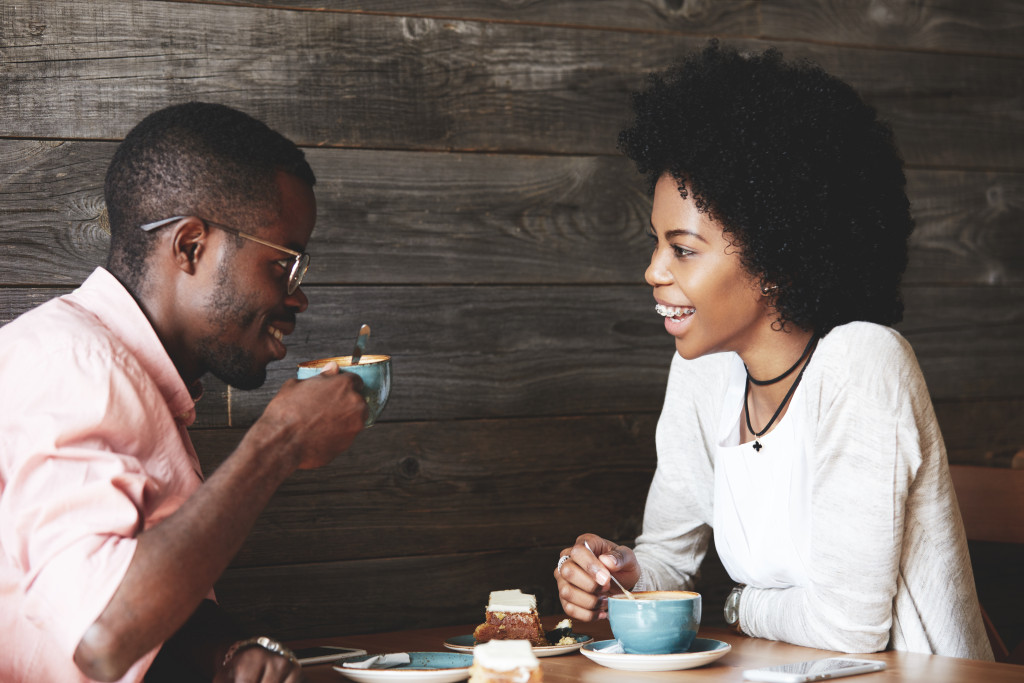 two persons on a date having coffee